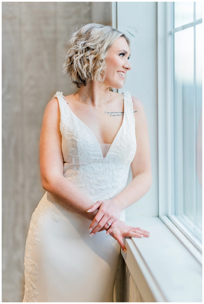 denver wedding photography bride gazing out the window