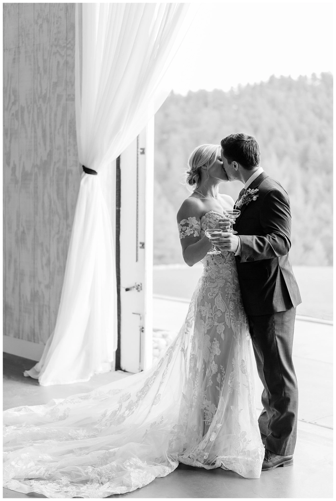 colorado bride and groom kissing and toasting wedding photos