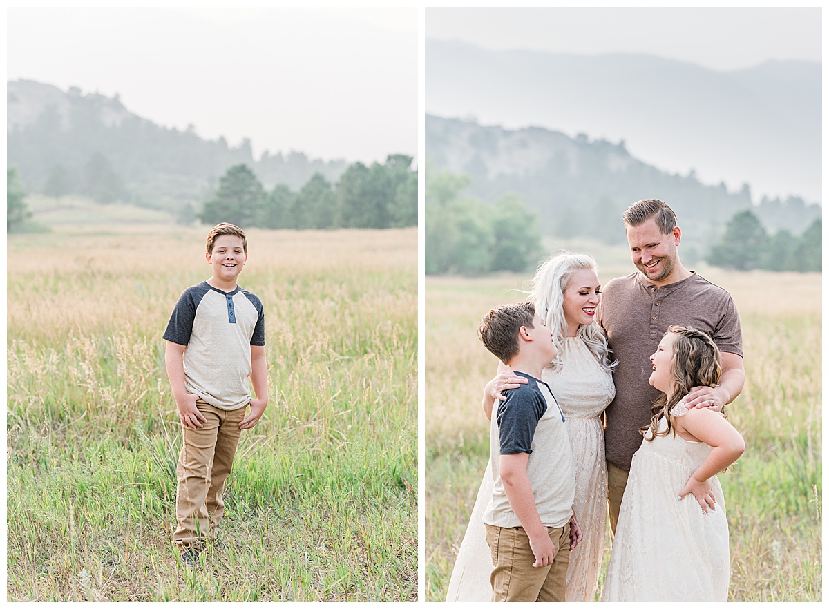 boy stands in meadow; family stands in field