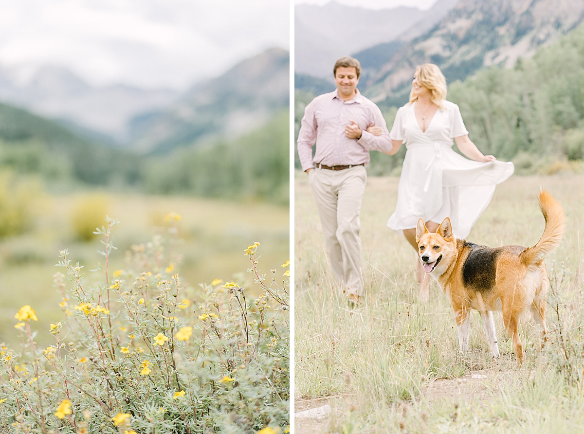 An engaged couple walks through the meadows with their dogs in Aspen.