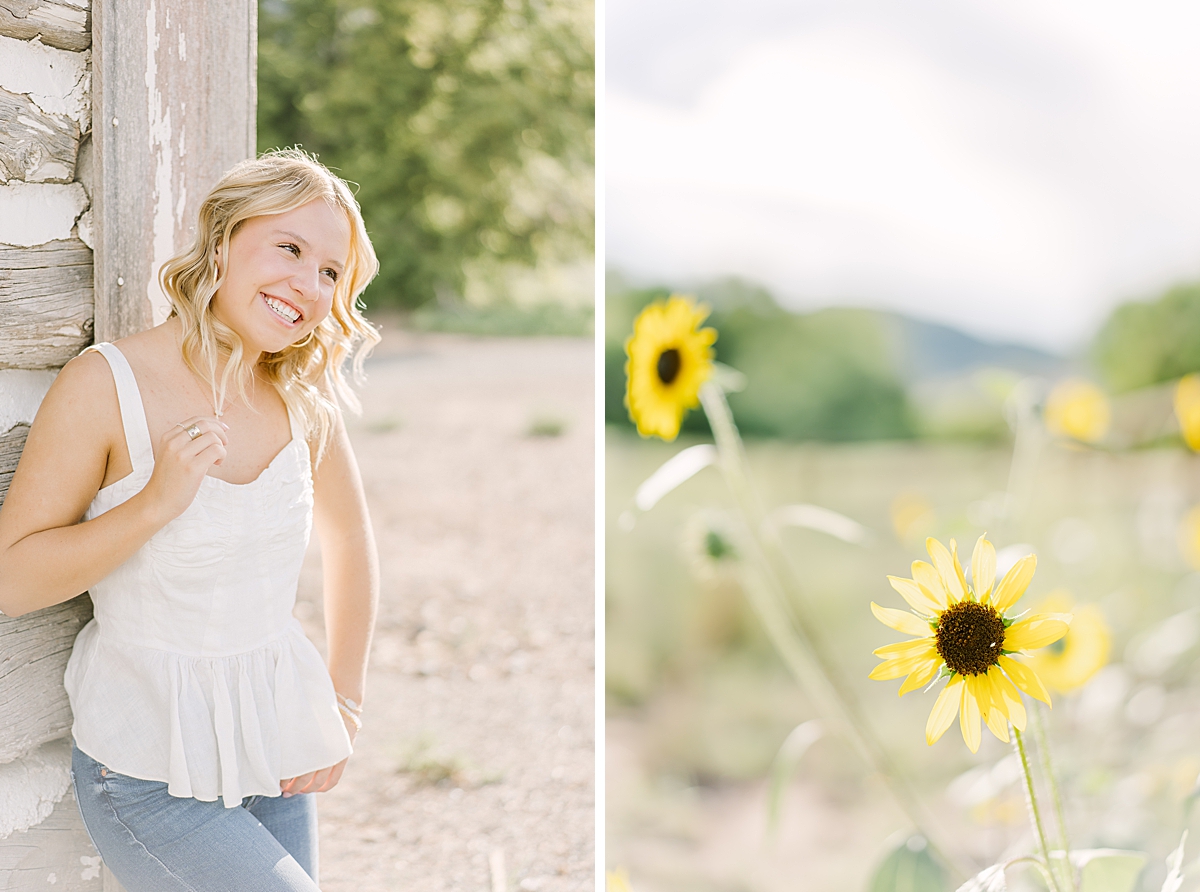 A cute senior poses by the whitewashed barn at Hildebrand Ranch.