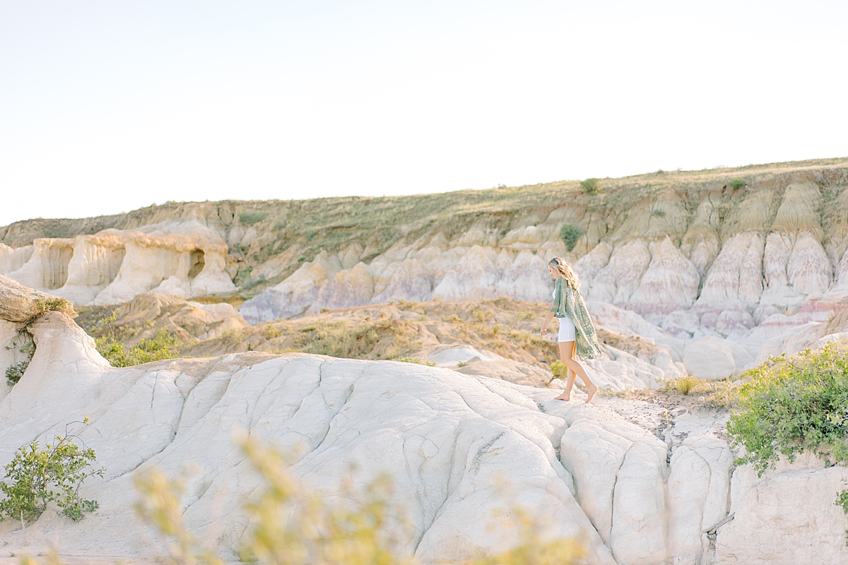 A blonde girl walks at the Paint Mines.