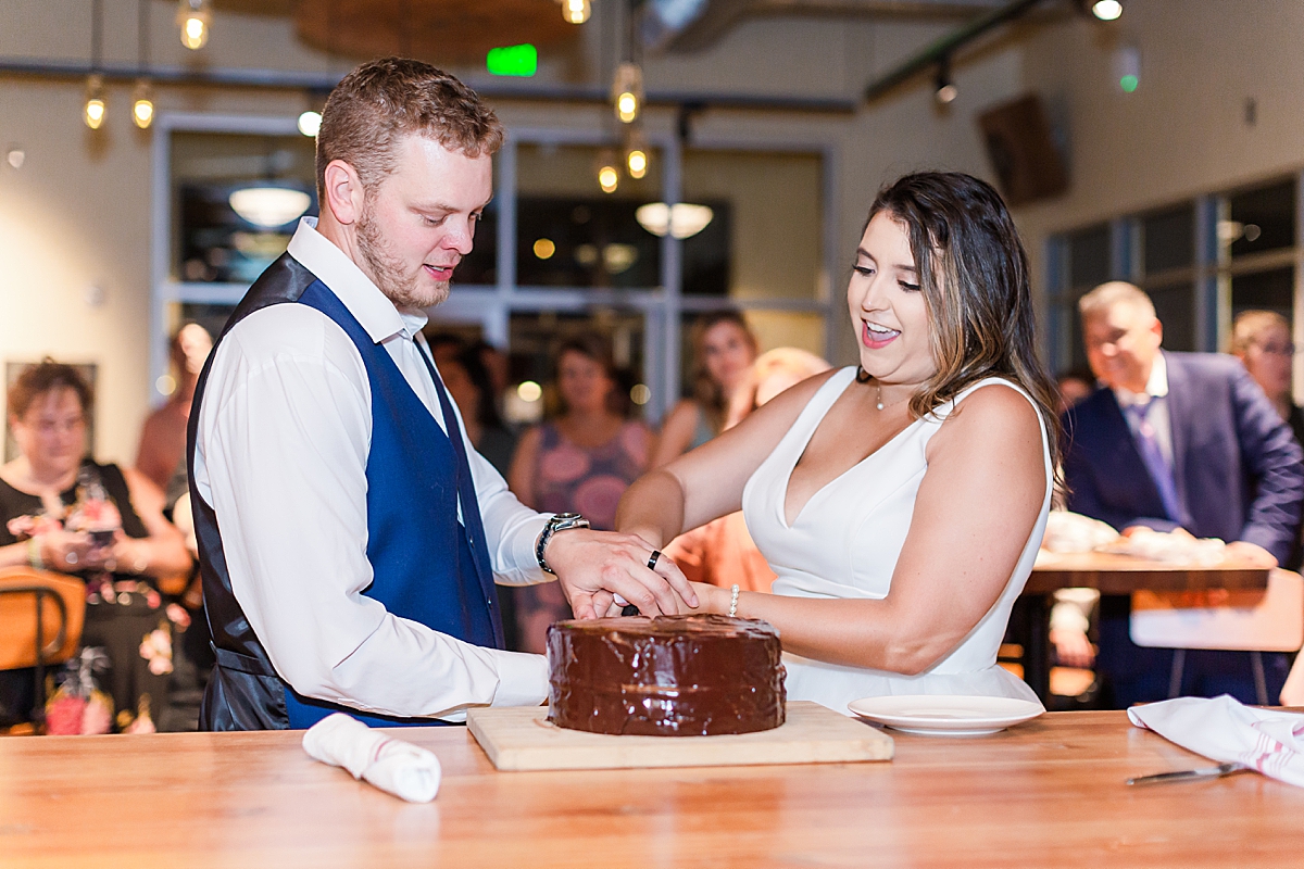 bride and groom cut the cake at Breckenridge brewery