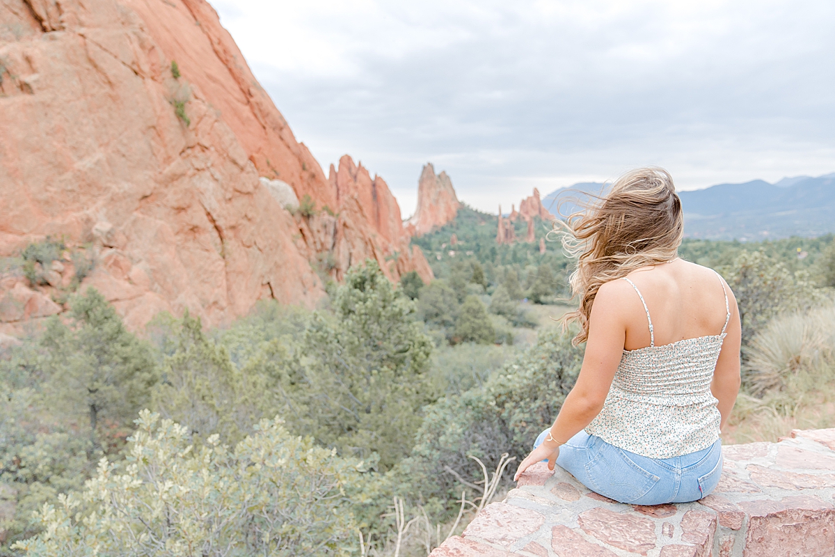 A young blonde girl overlooks the Garden of the Gods.