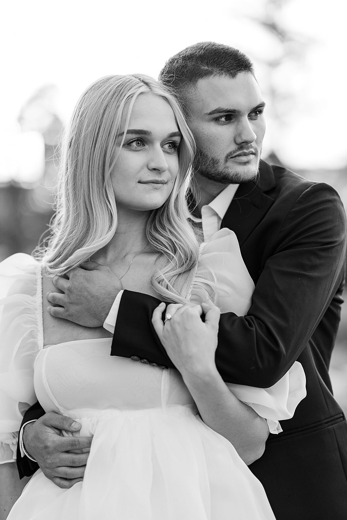 A dramatic black and white image of a model couple.