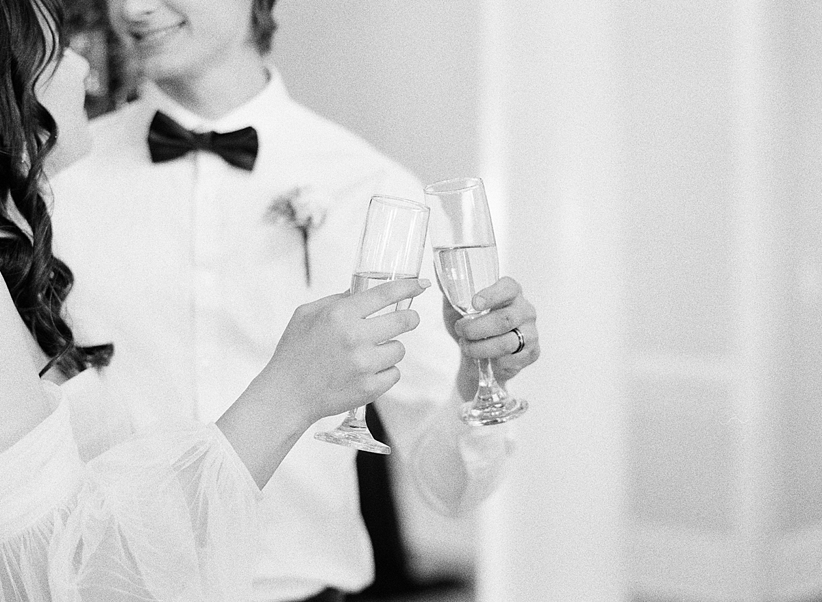 A bride and groom toast at their Flying Horse Ranch wedding.