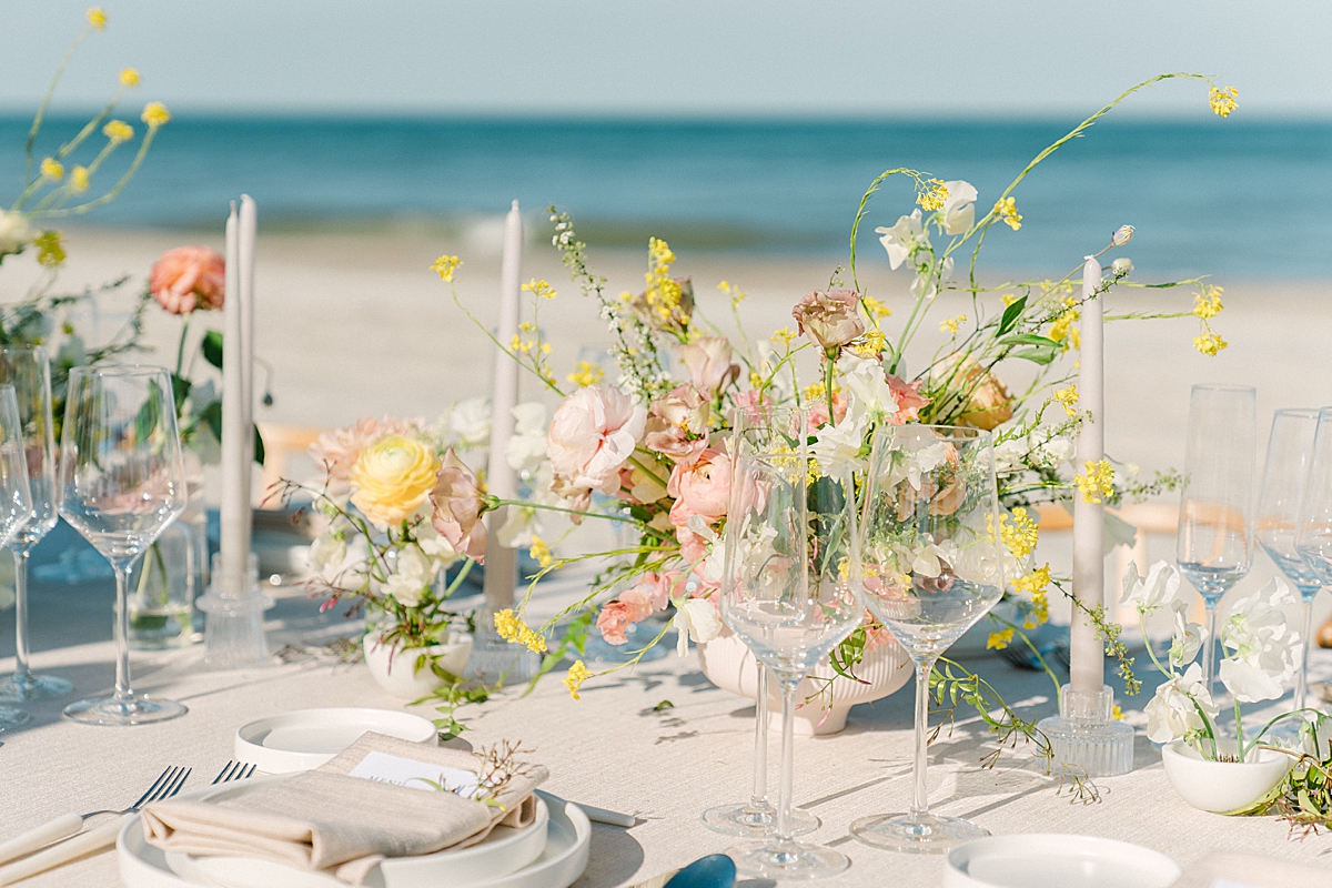 Modern beach destination wedding tablescape at the reception