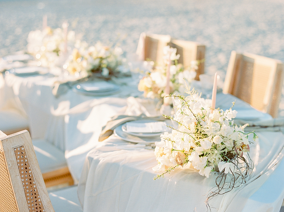 Shades of creams, whites, soft ochre, blush, and muted greens wove throughout the floral bouquet and centerpieces.