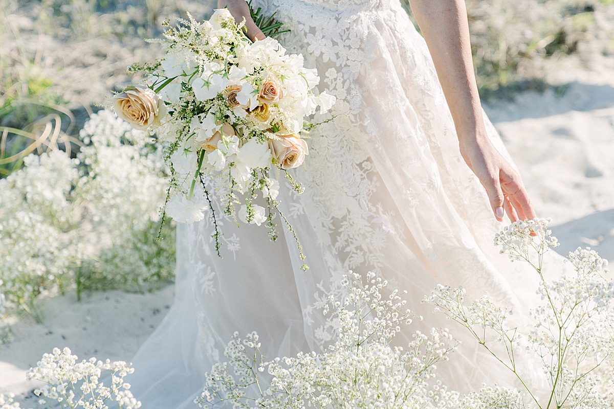 This beautiful couple walked through an aisle of white clouds, while gracefully brushing past the baby's breath.