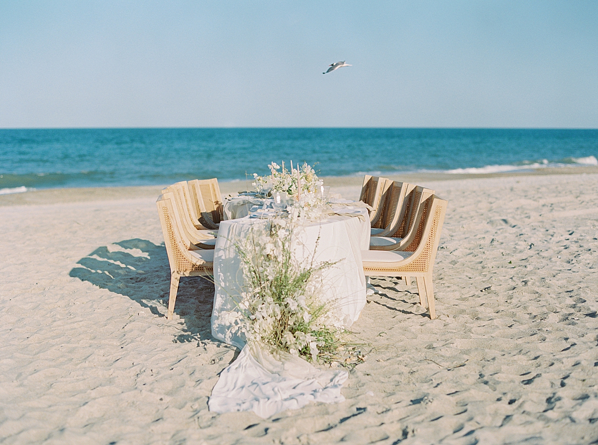 Luxury beach wedding on film reception table