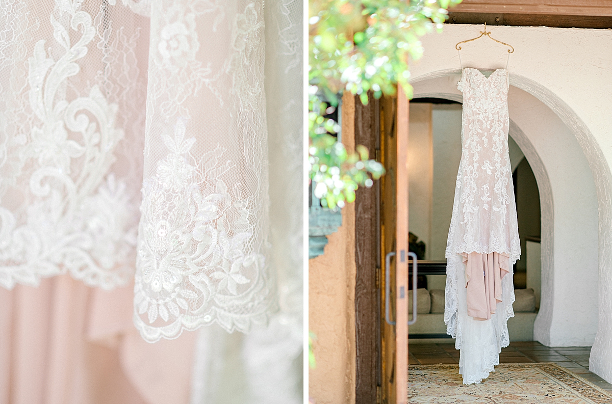 A Justin Alexander lace dress hangs in the doorway at Villa Parker.