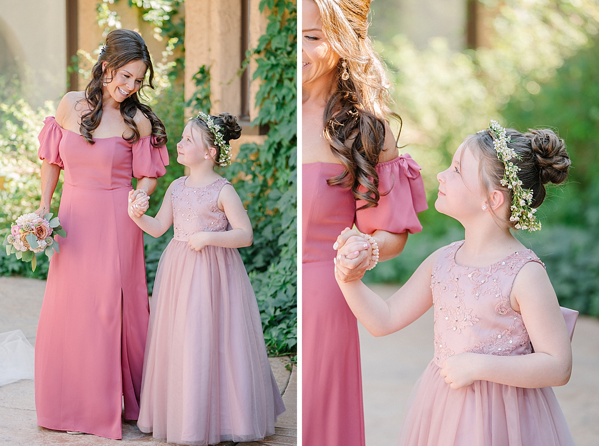 A flower girl holds her Mom's hand at a Villa Parker wedding