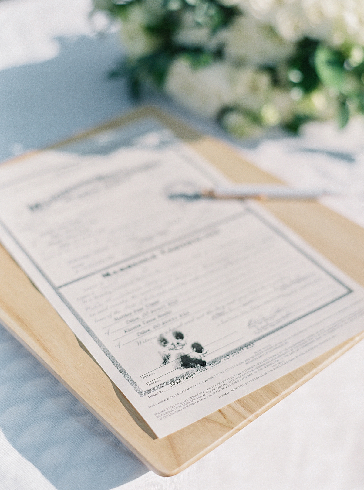 a colorado marriage license with paw print signature