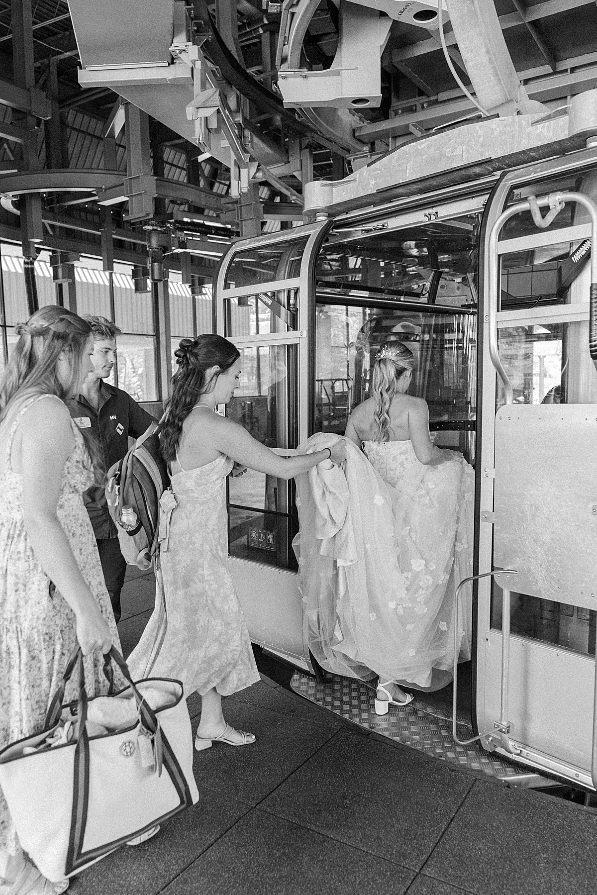 Bride and bridesmaids step onto gondola for Vail Wedding Deck Summer Wedding