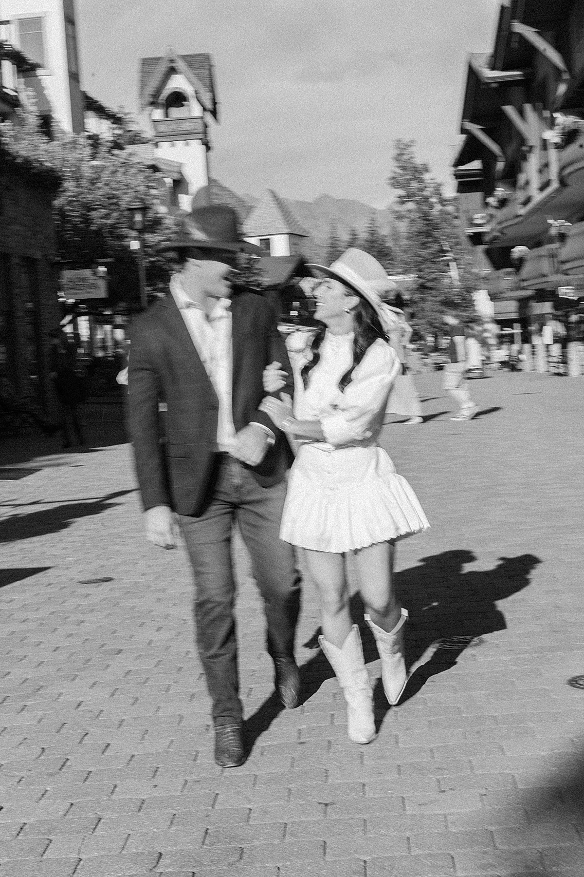 Black and white engagement photos in Vail Village with the Gore mountain range, taken by a Vail engagement photographer.