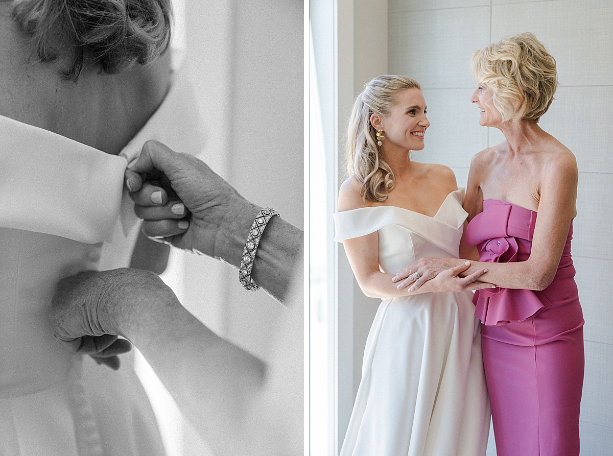 A mother zips up her daughter's wedding dress