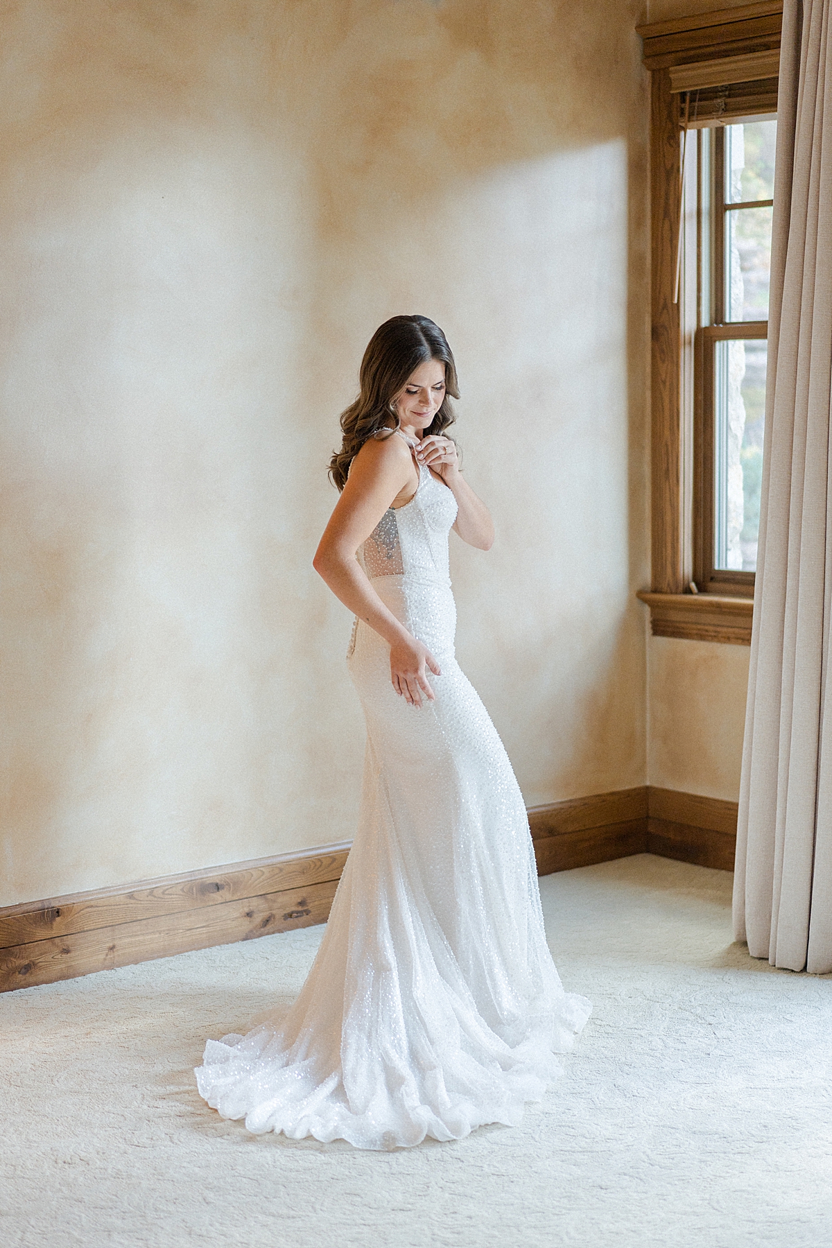 A bride gets dressed for her Beaver Creek Micro Wedding Colorado