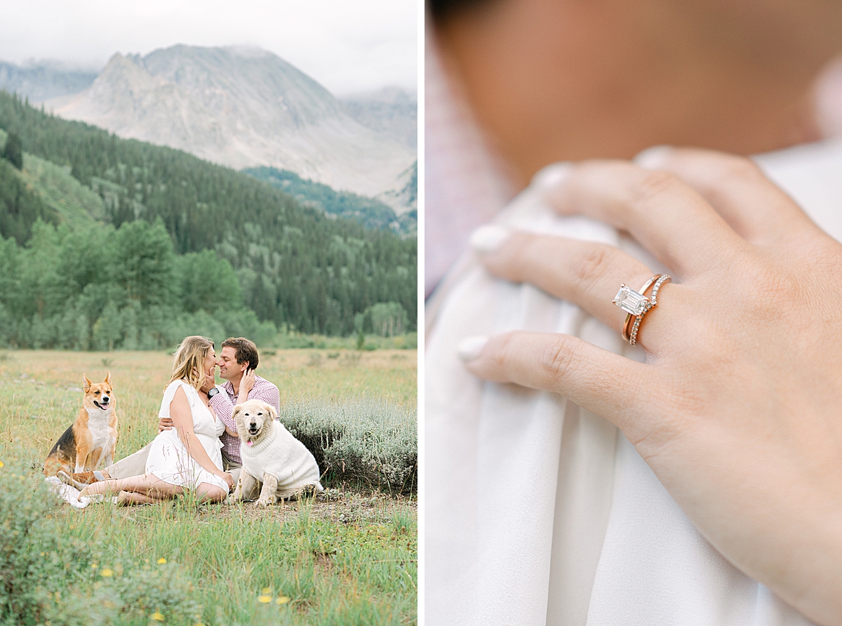 A couple kisses in the meadow at Ashcroft with their dogs, while taking aspen colorado engagement photos.